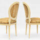 4 chaises laquée blanc de style Louis XVI