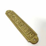 Brass bathroom door plate