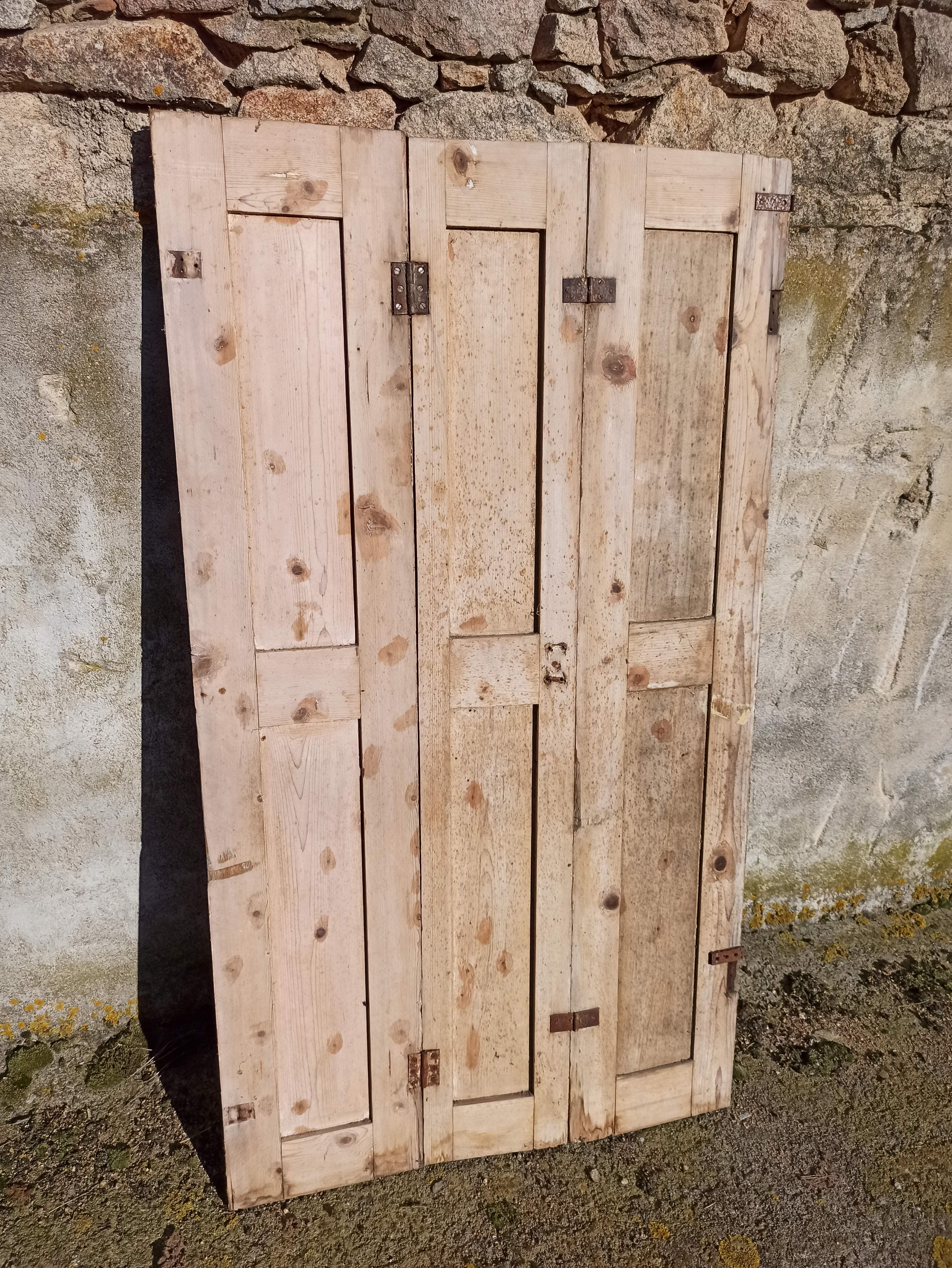 Old trio of wooden screen doors