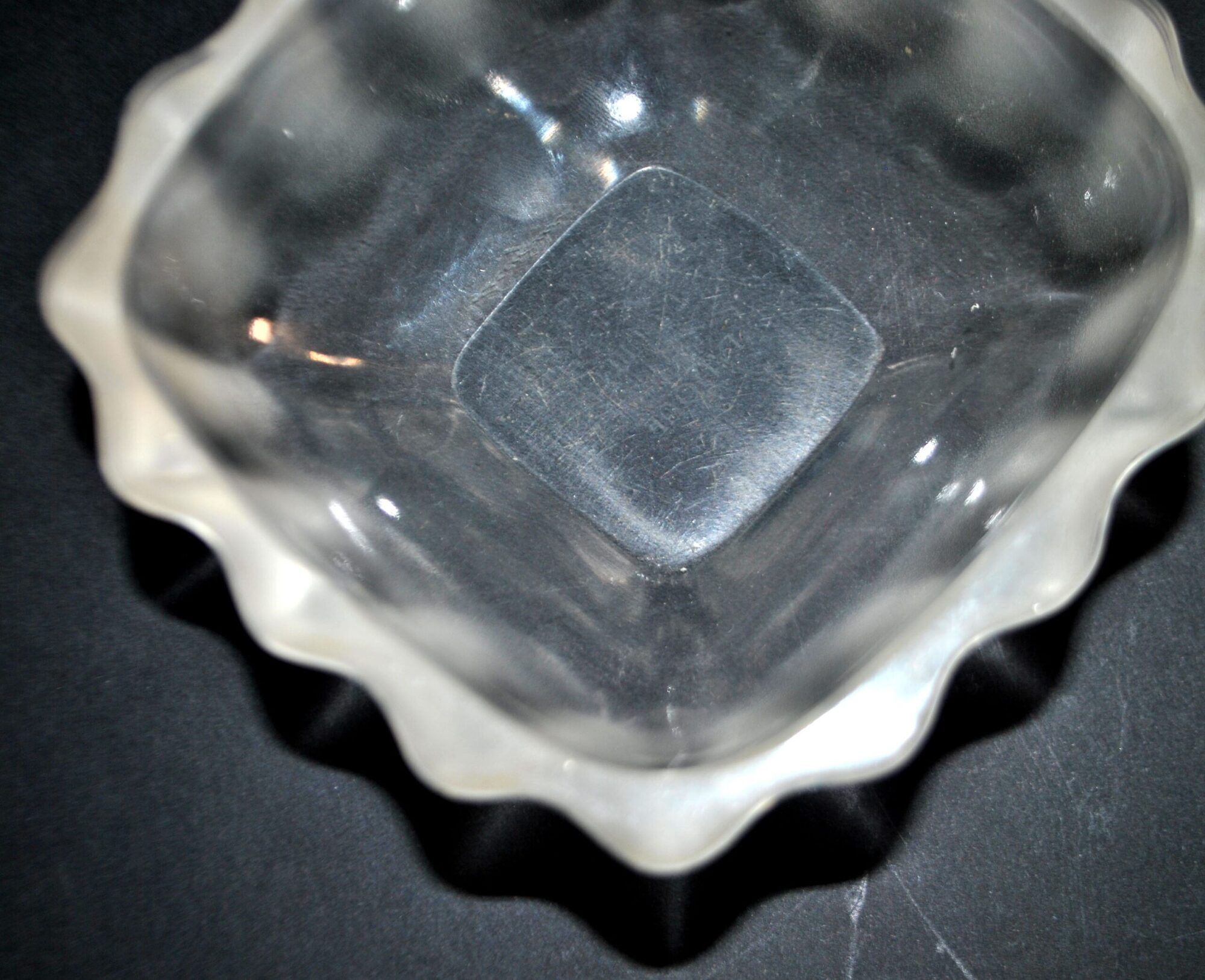 Lalique glass ashtray bowl with frosted finish, engraved with wave design, signed Lalique.