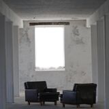 Pair of modern Danish lounge chairs in dark brown leather and rosewood, 1960s.