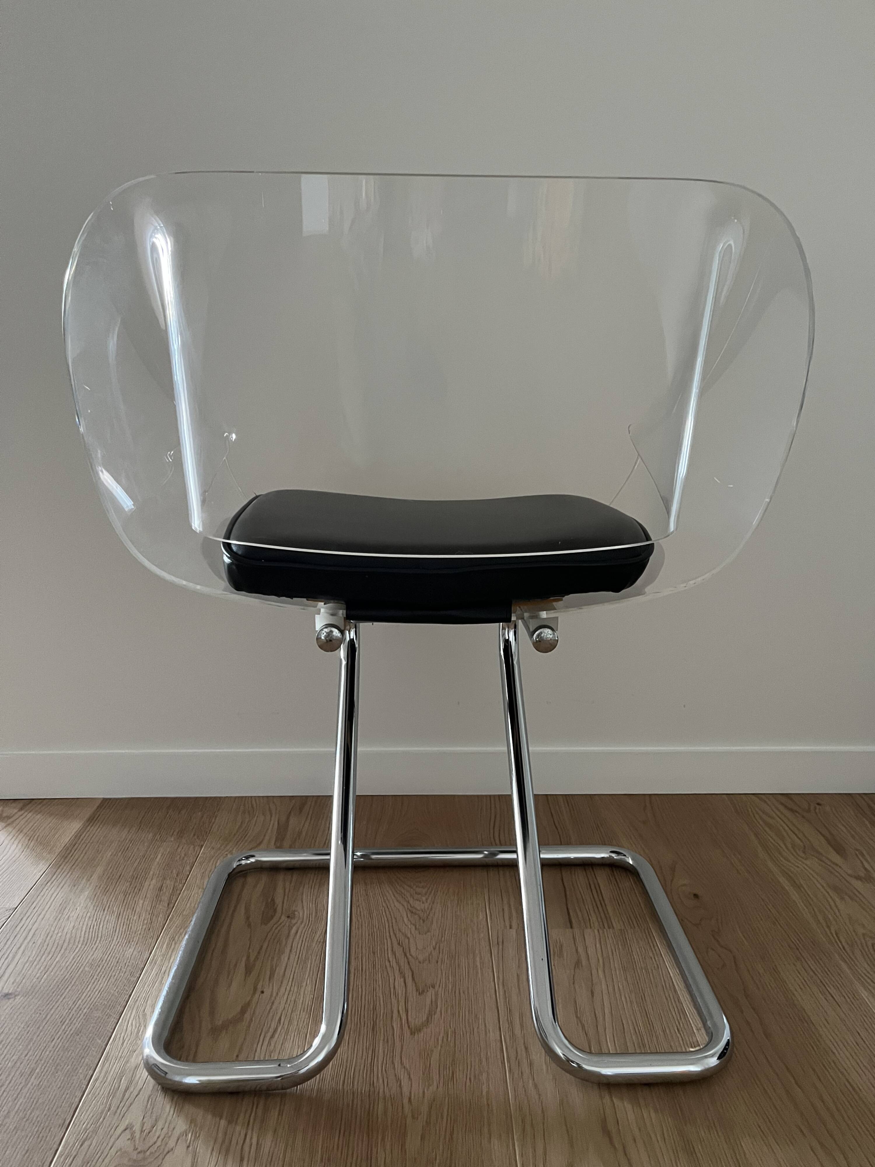 1970s chairs in acrylic and metal designed by Harvey Guzzini.
