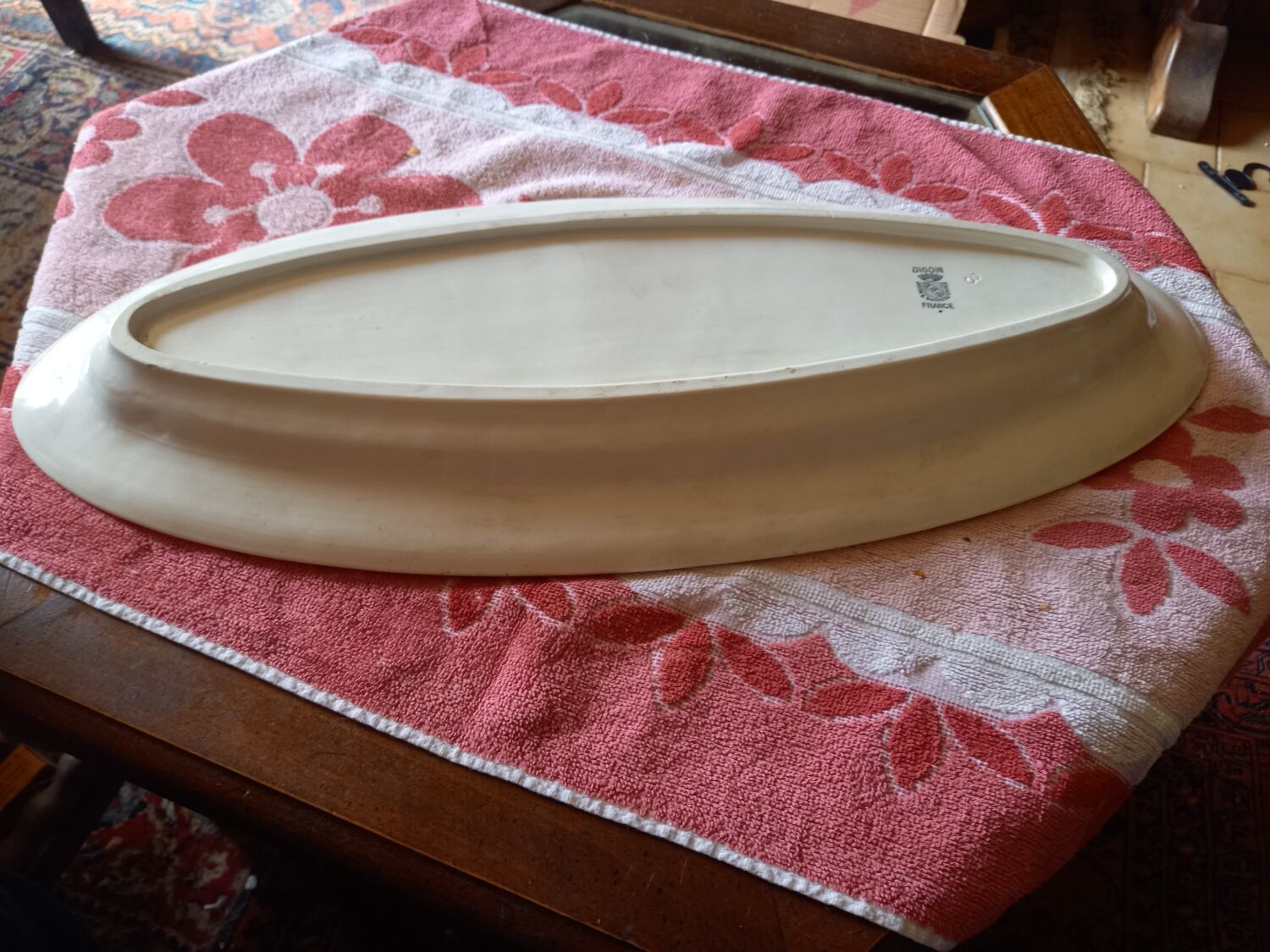 Old white earthenware fish dish