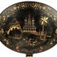 Large tilting pedestal table, black lacquered wood with a lively oriental landscape decoration.