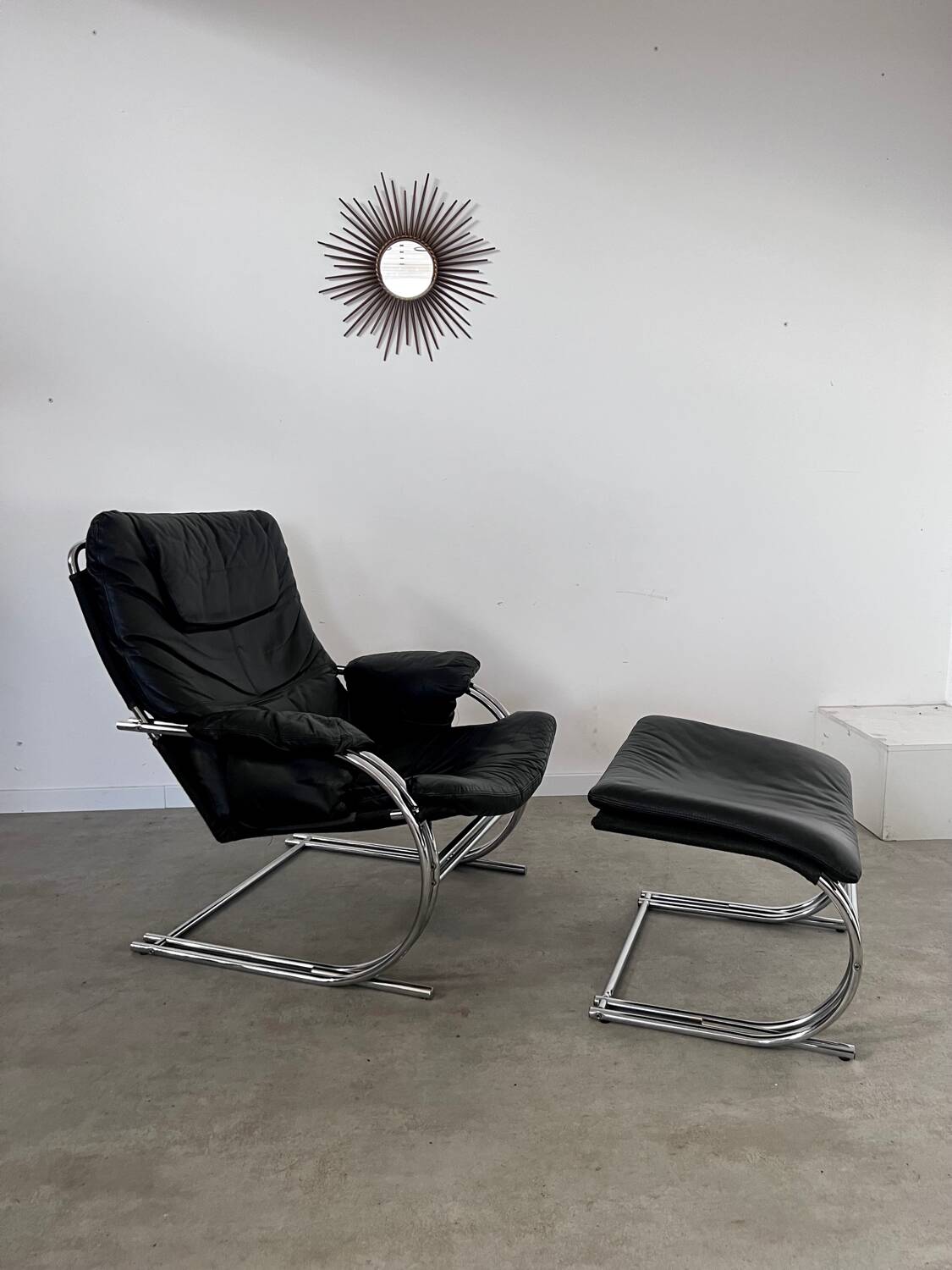 Old armchair and ottoman black leather tubular chrome bauhaus design from the 70s