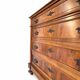Antique walnut commode with bronze handles in the shape of a lion's mask,