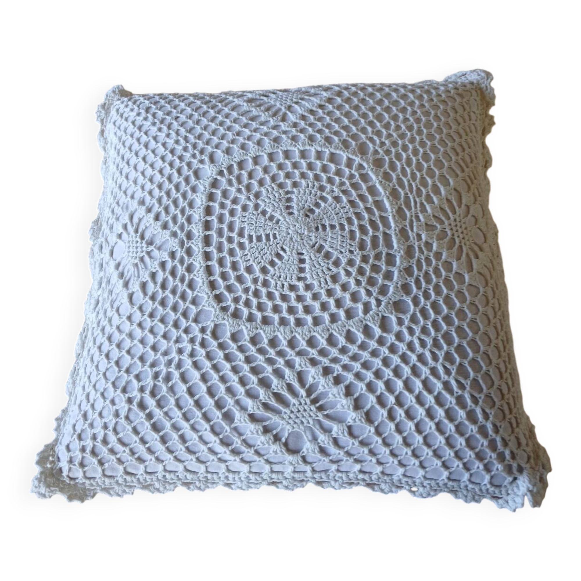 Cushion with white crochet cover