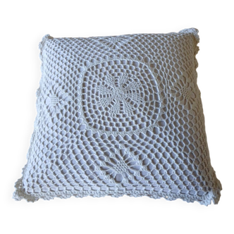 Cushion with white crochet cover