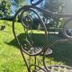 Old wrought iron table and its armchairs and chairs for outdoor use.