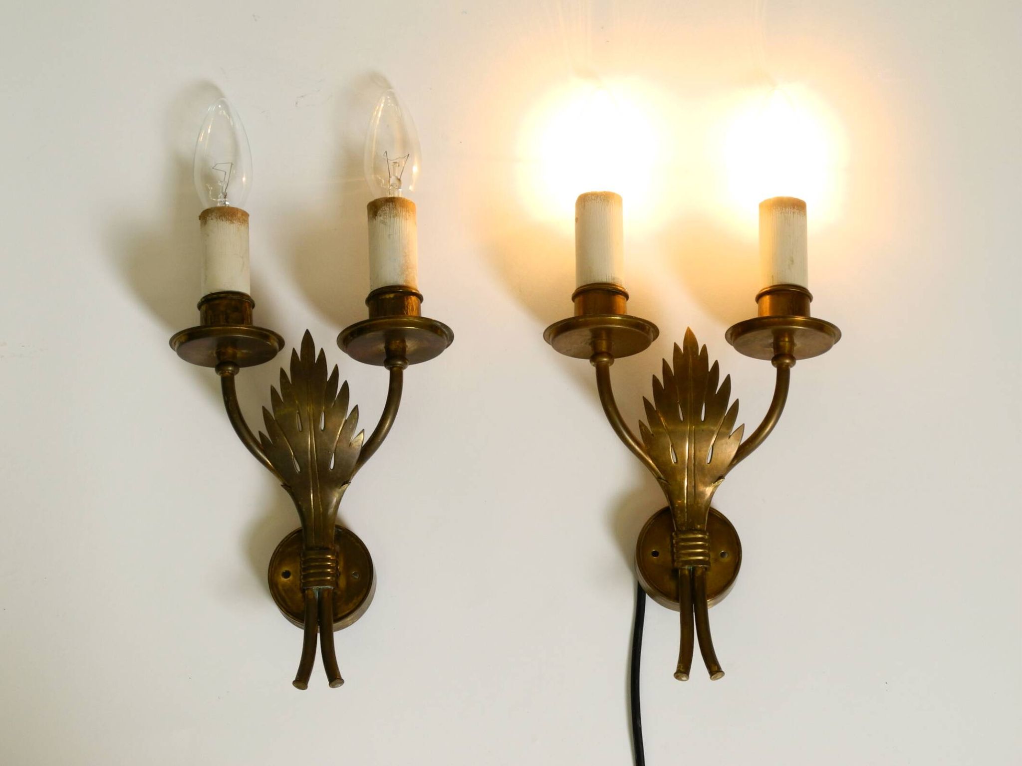 A pair of mid-century modern brass wall lamps by Vereinigte Werkstätten