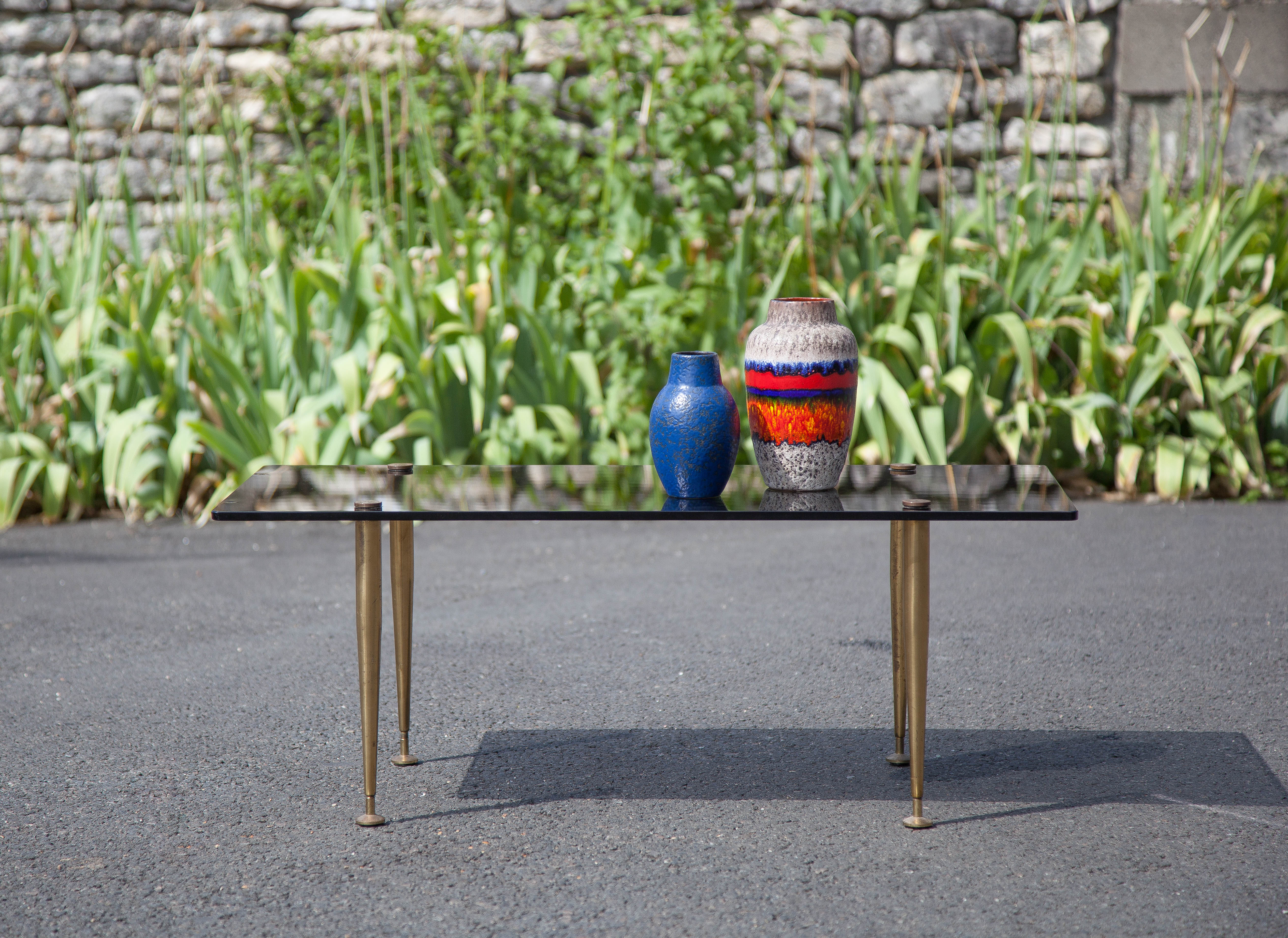 Smoked glass coffee table with adjustable brass legs, end of sofa, 70s table