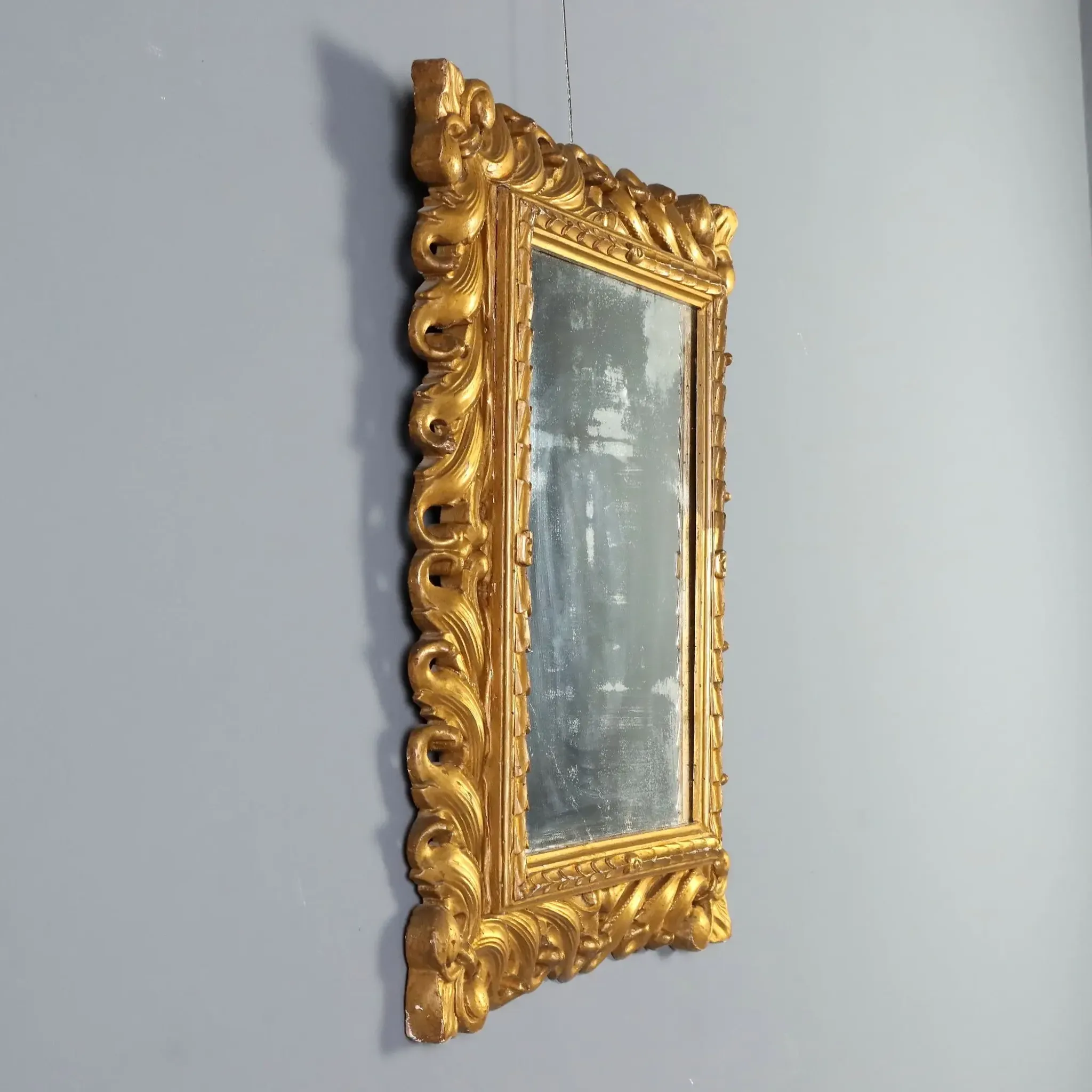 Eclectic antique mirror in carved and gilded wood, Italy, 20th century