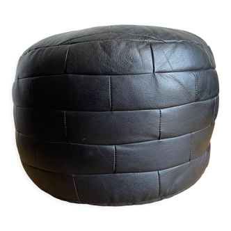 Black patchwork leather pouf from Sède