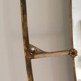 Oval mirror in art deco brass, Italy 1940s.