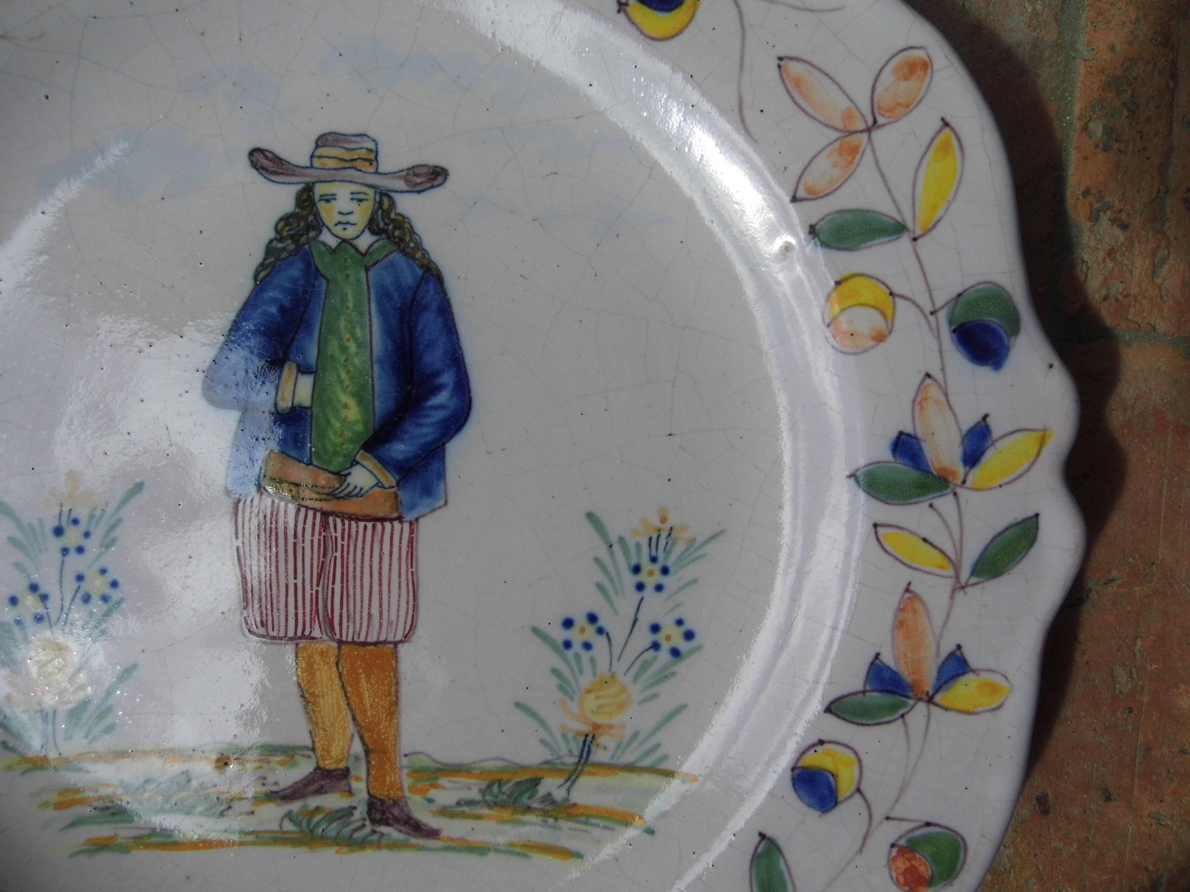Malicorne earthenware plates, late nineteenth century, Breton décor.