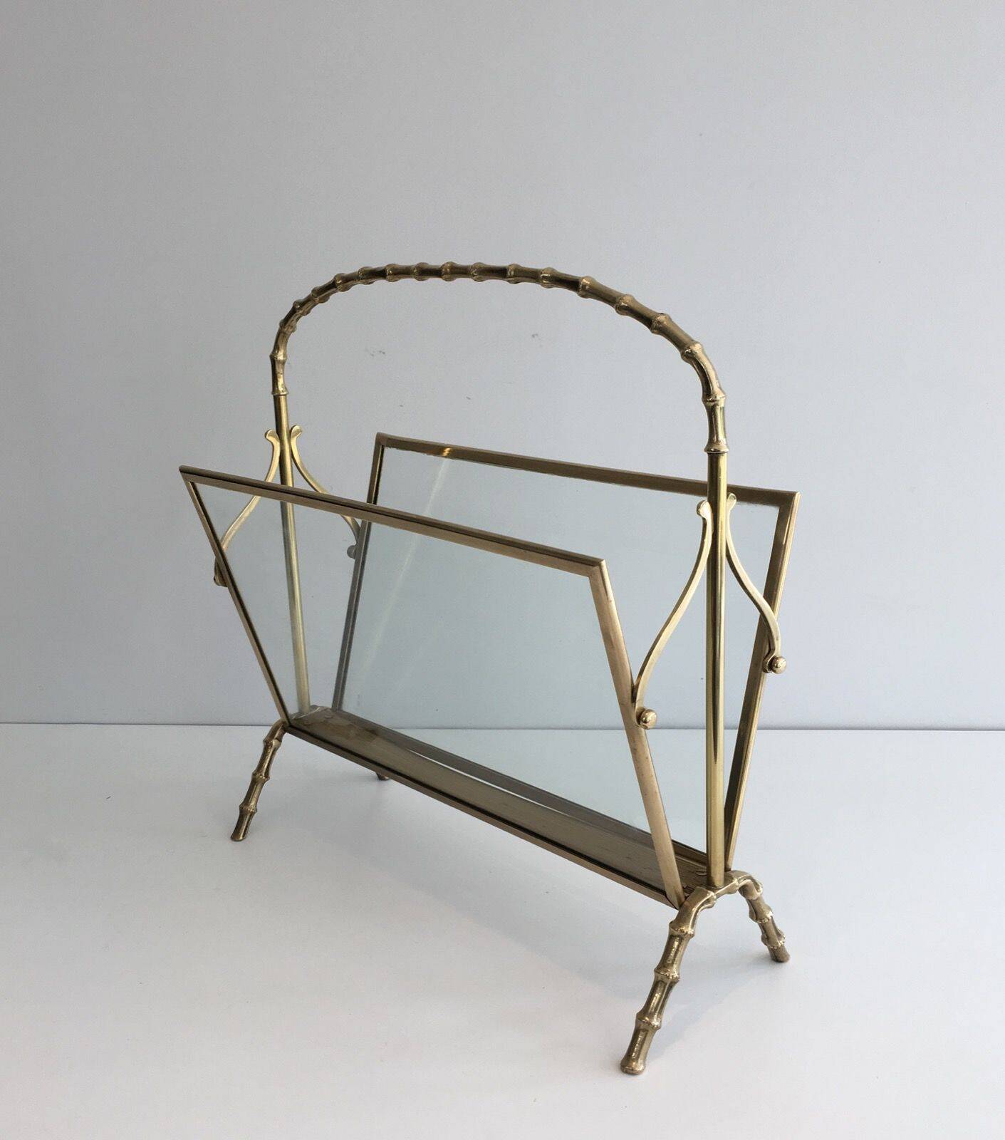 Bamboo-style brass magazine rack from the Baguès house.