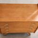Vintage 1960s commode with tapered legs.