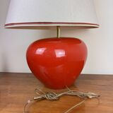 large vintage ceramic lamp with flower decorations on a red background circa 1980