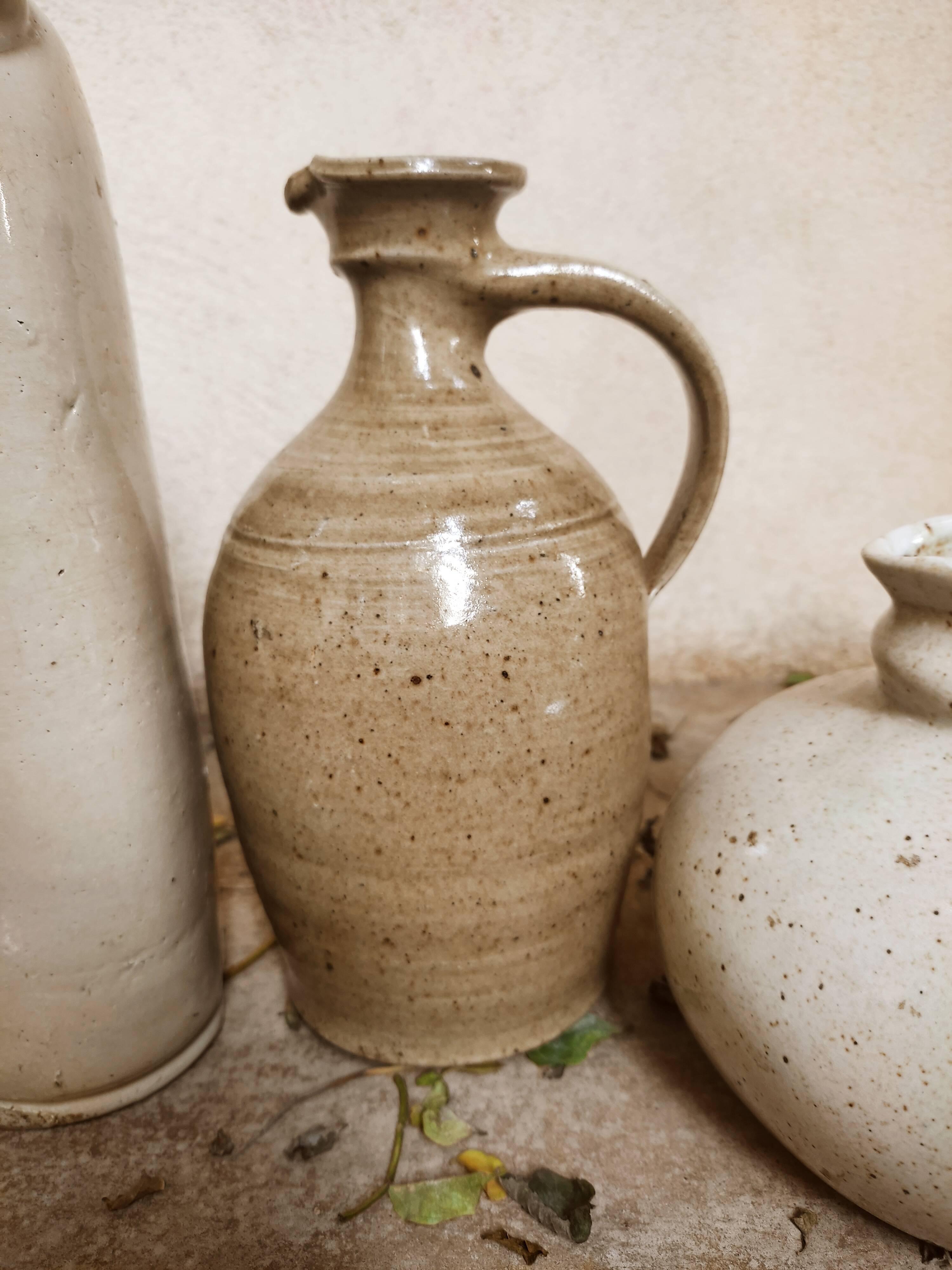 Stoneware decanters and candle holder