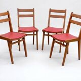 Vintage chairs from the 1950s in wood and faux leather.