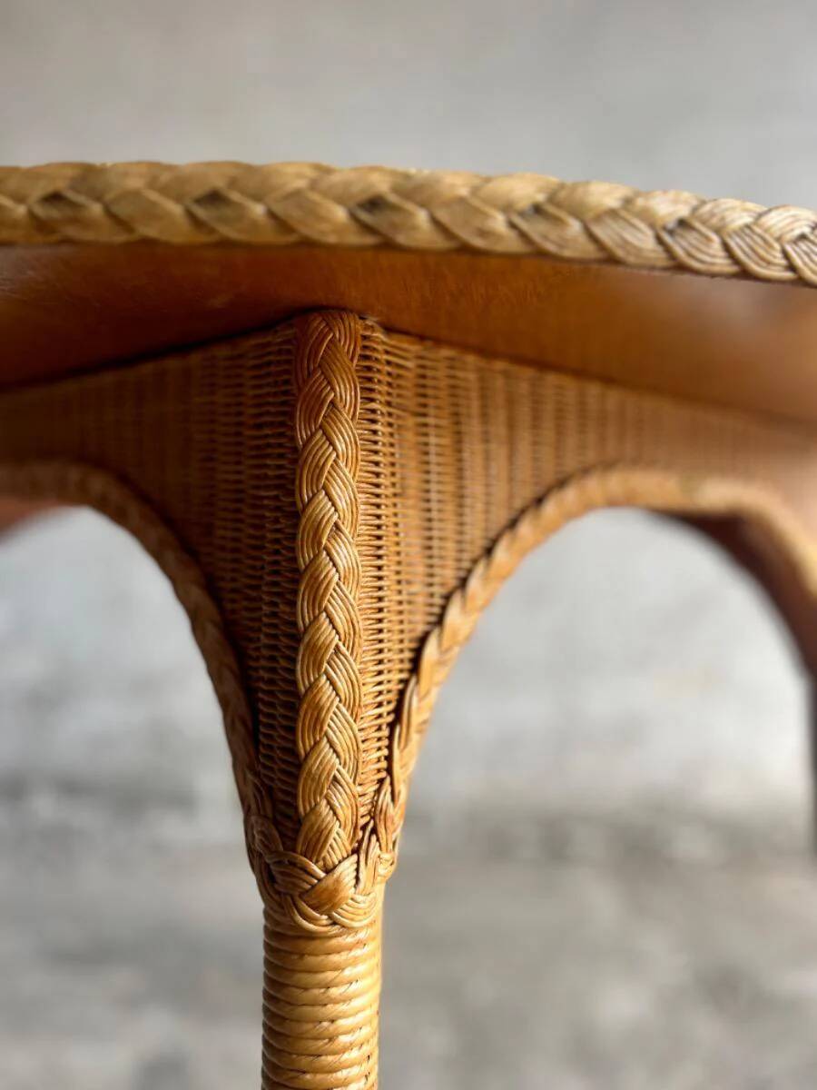 Natural Lloyd Loom paper cord rattan round table with brass-capped legs by Vincent Sheppard