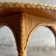 Natural Lloyd Loom paper cord rattan round table with brass-capped legs by Vincent Sheppard