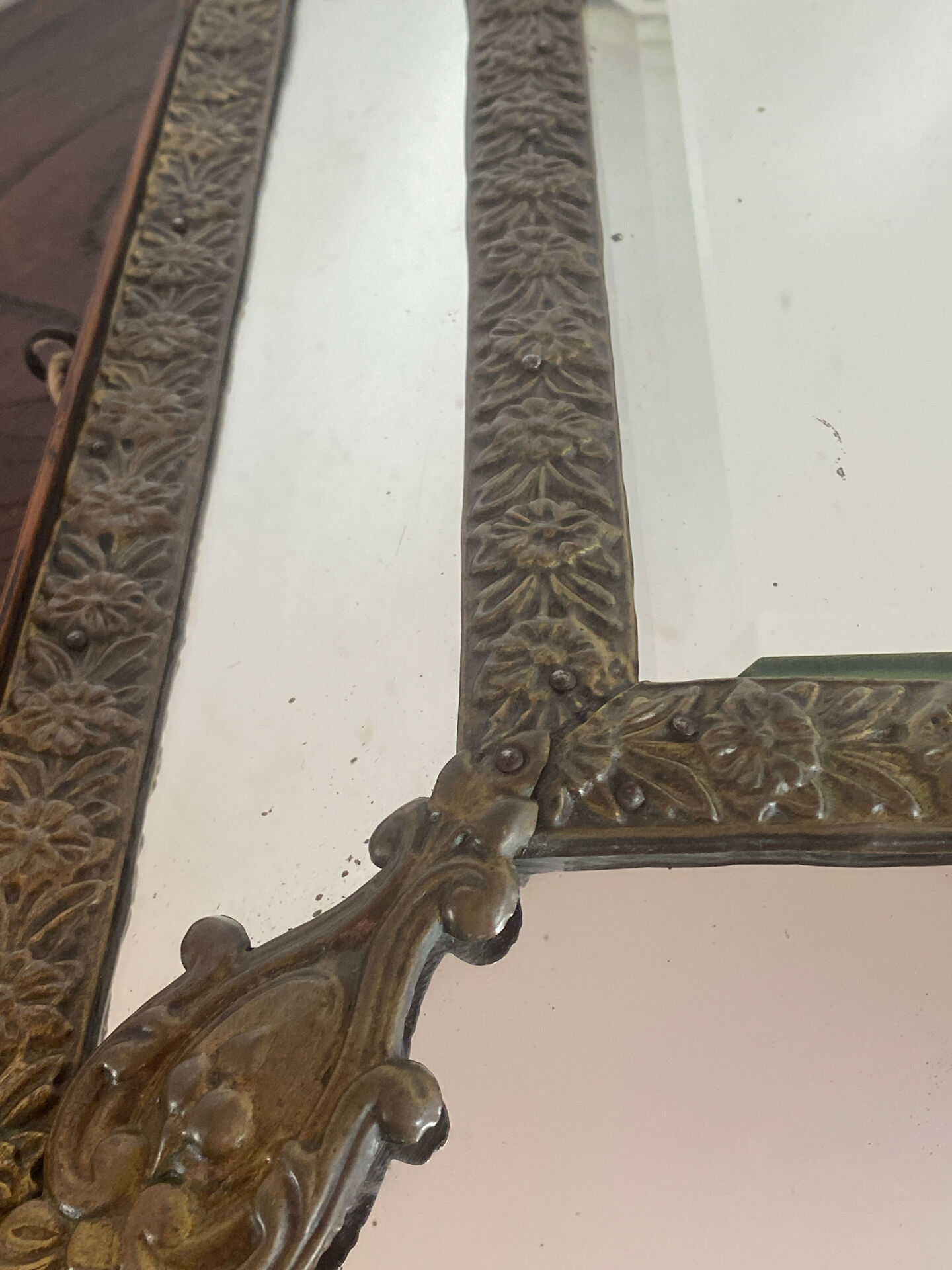 Mirror with brass repoussé frame