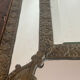 Mirror with brass repoussé frame