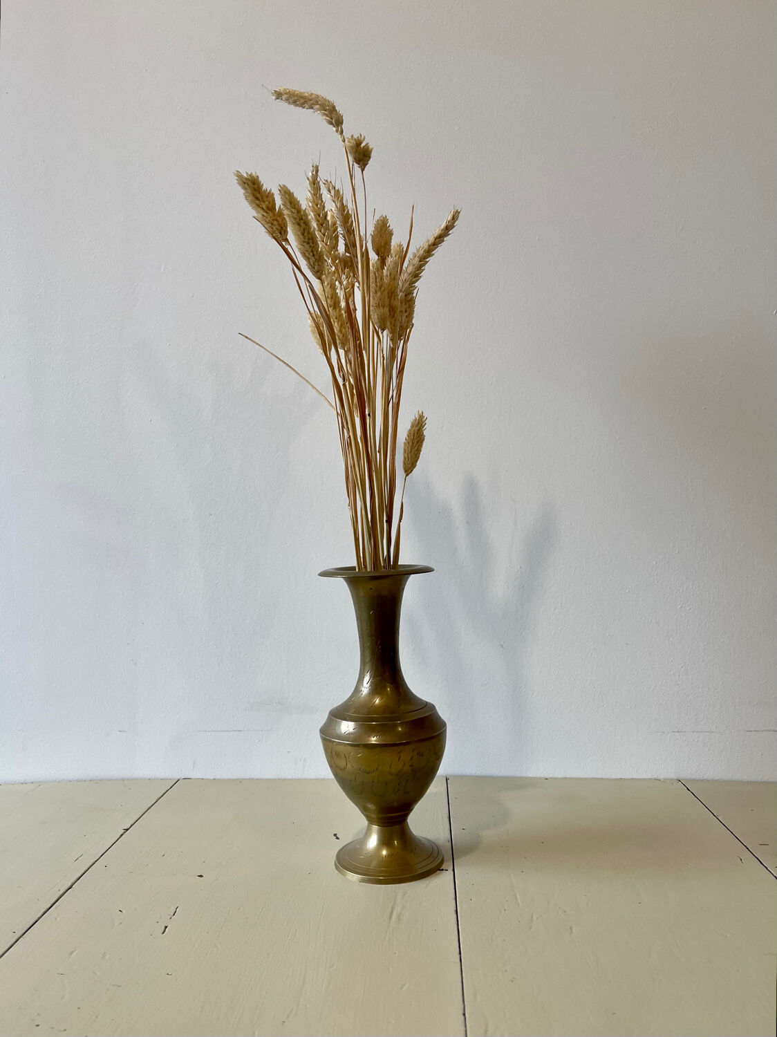 Engraved brass vase