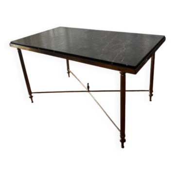 Black marble coffee table with brass legs.