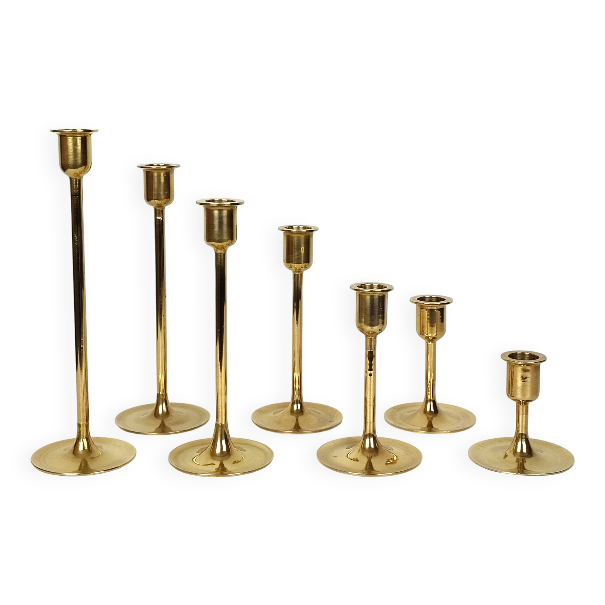 Set of 7 brass candlesticks