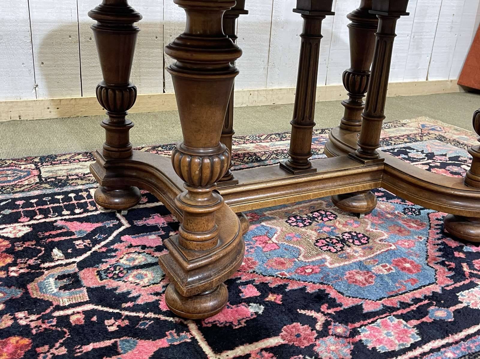 Henri II walnut table from the early 20th century with extensions.