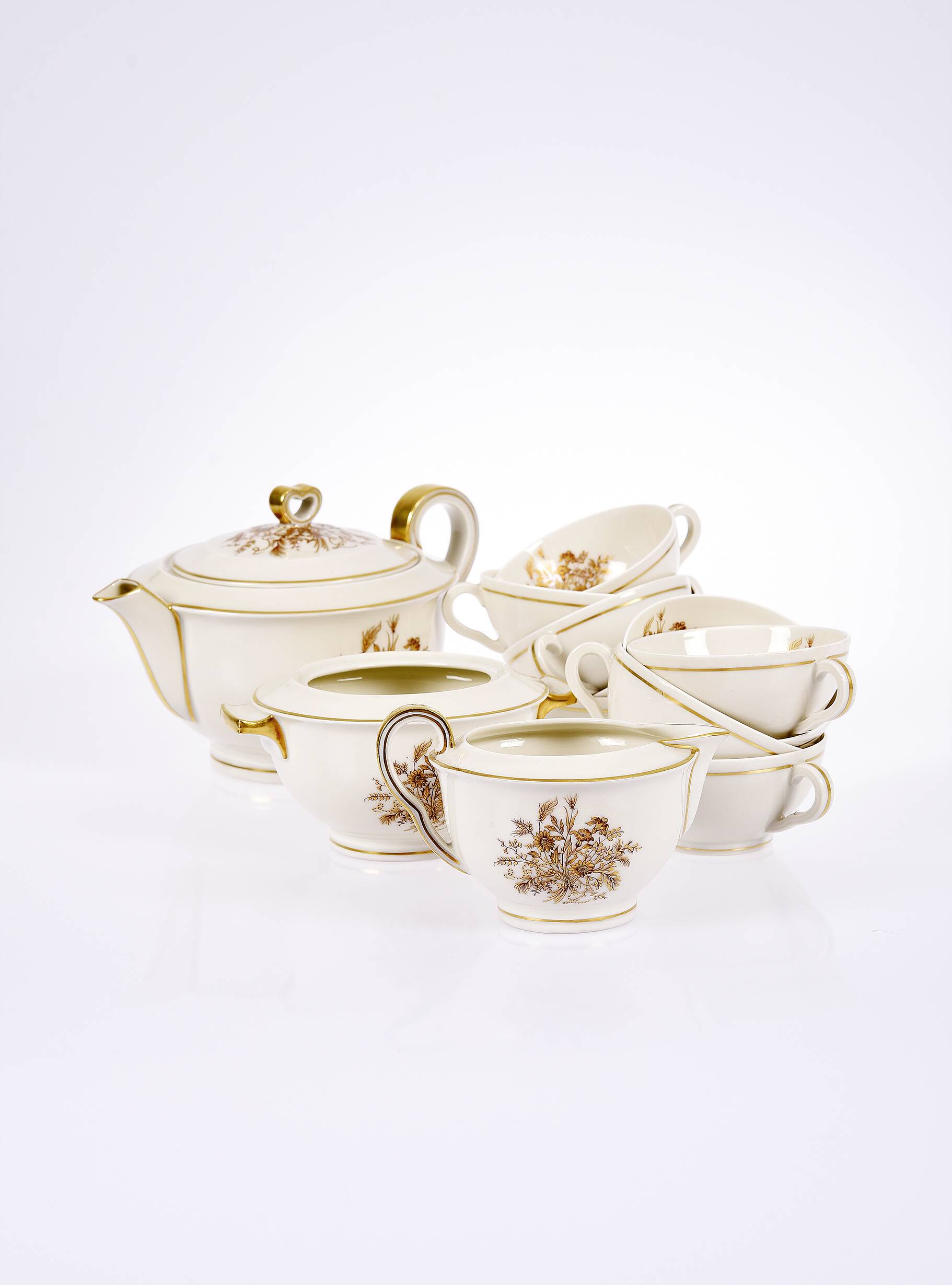 Porcelain tea service by Théodore Haviland, gilded patterns.