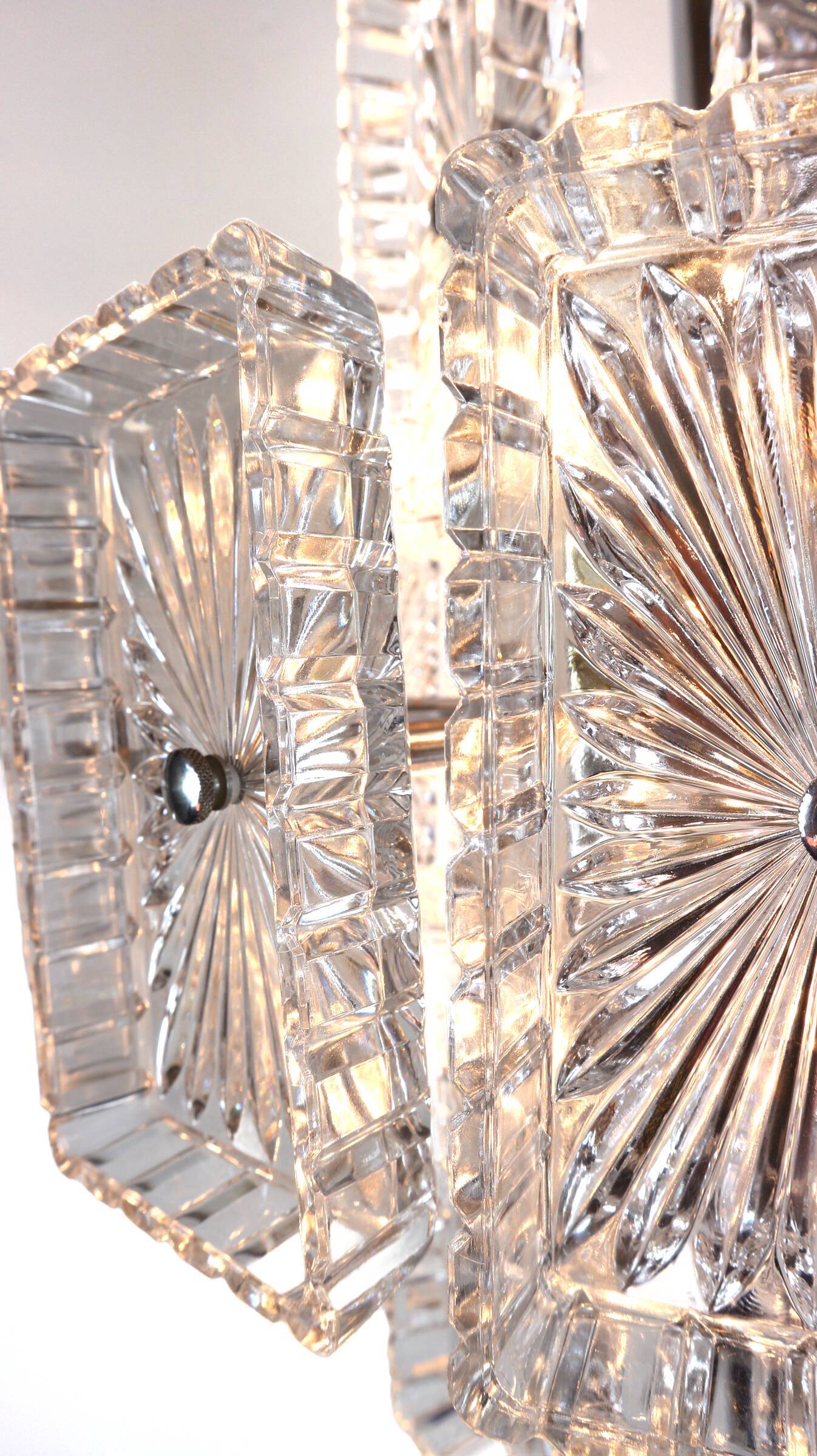 Vintage metal chandelier and carved glass