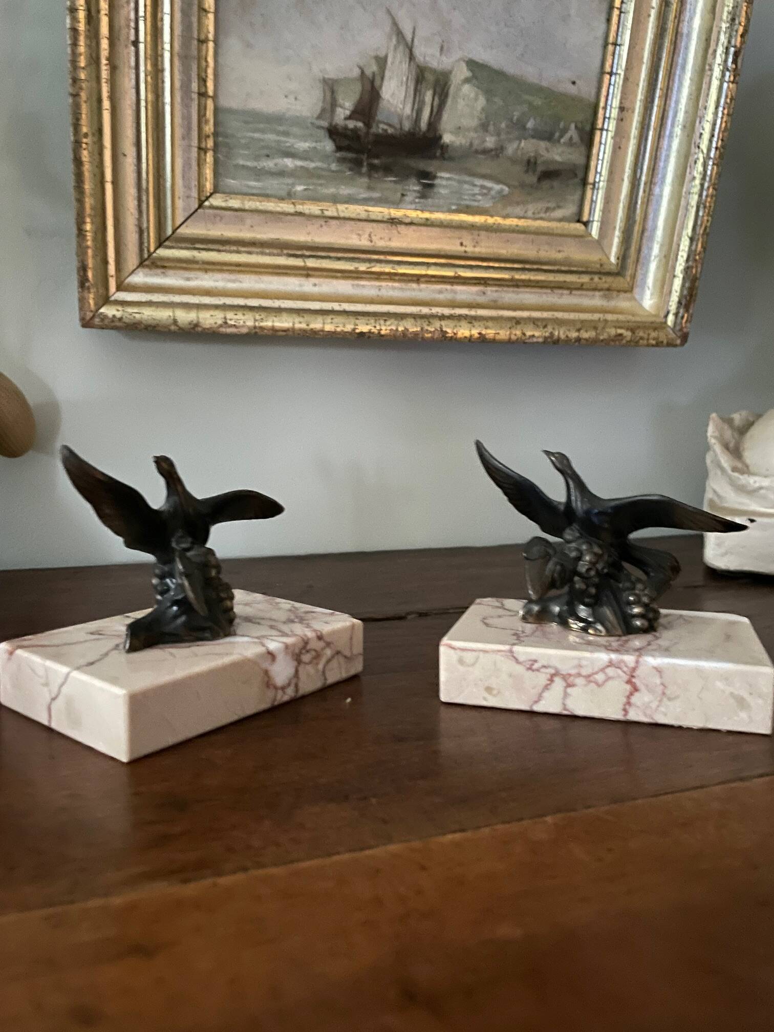 Pair of marble bookends with bronze birds