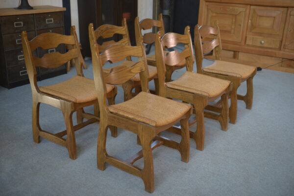 Set of 6 oak dining chairs with rush seat and 'Echelle' backrest in the style of Guillerme et Chambron 1950s