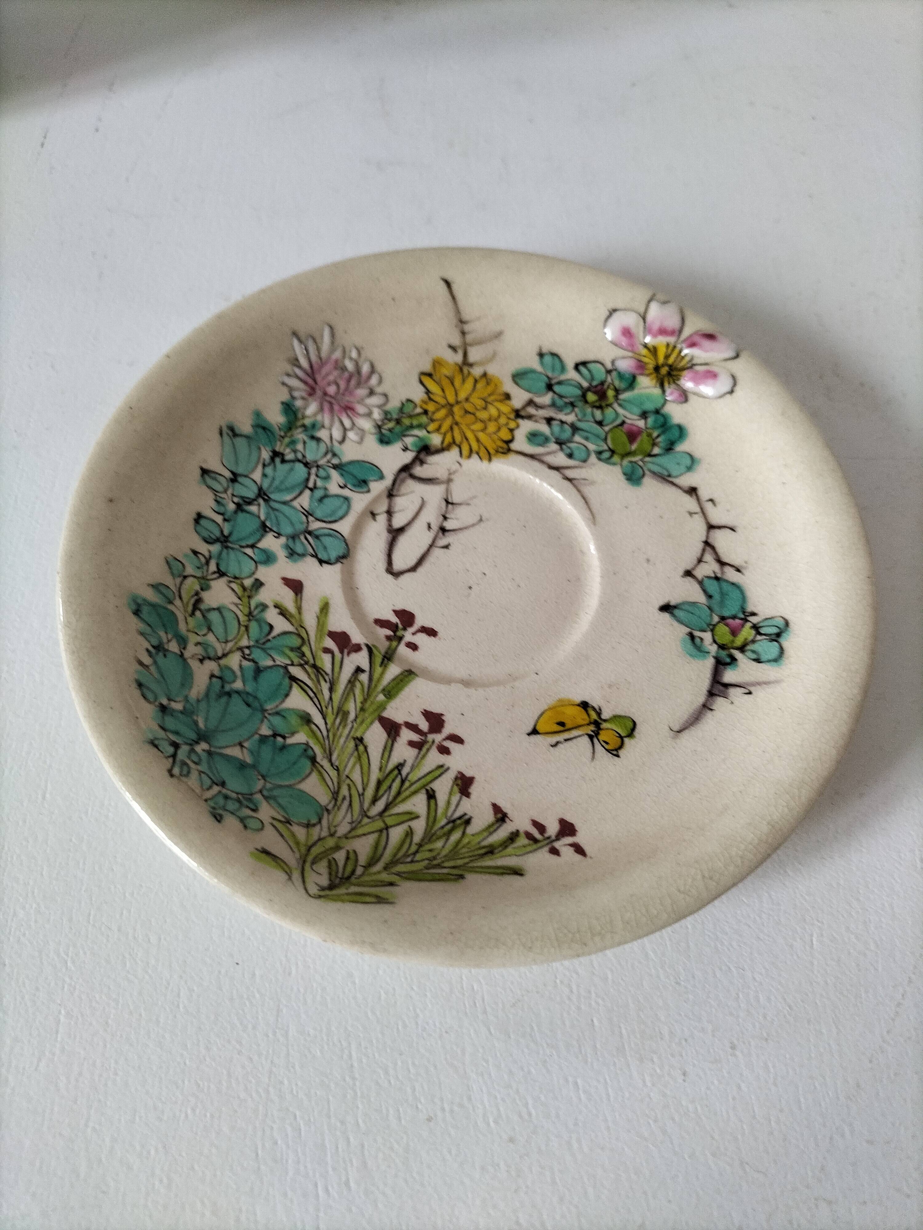 Japanese-style tea set in cracked earthenware with chrysanthemum flowers