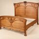Double bed from the Art Nouveau period – Carved mahogany – Relief flowers