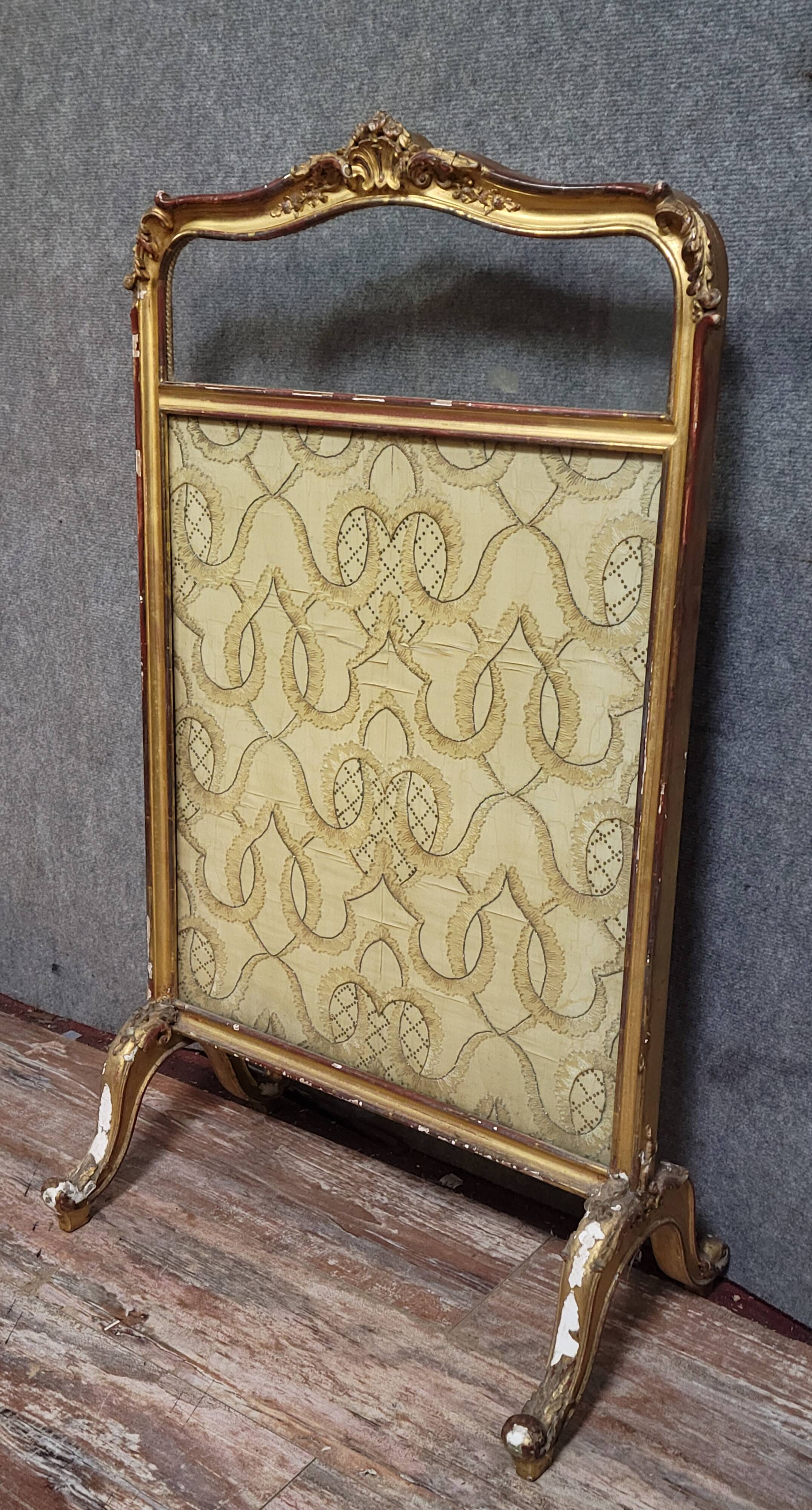 Antique Louis XV style fire screen, in carved and gilded wood, in need of restoration