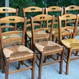 12 solid wood and straw chairs