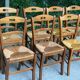 12 solid wood and straw chairs