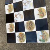 Vintage coffee table with black wrought iron and white tiles.