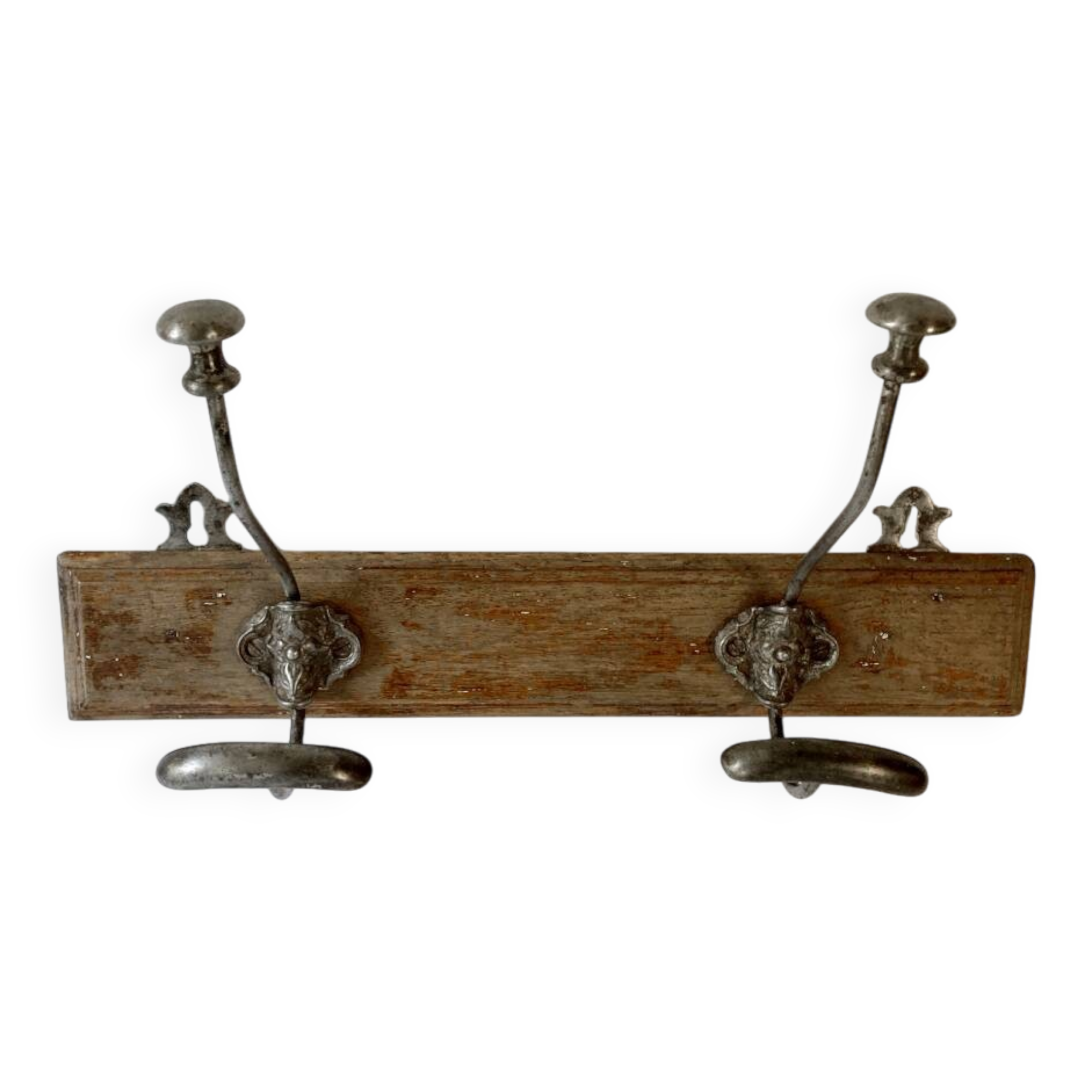 Pair of antique wrought iron coat hooks mounted on a wooden panel, 19th century