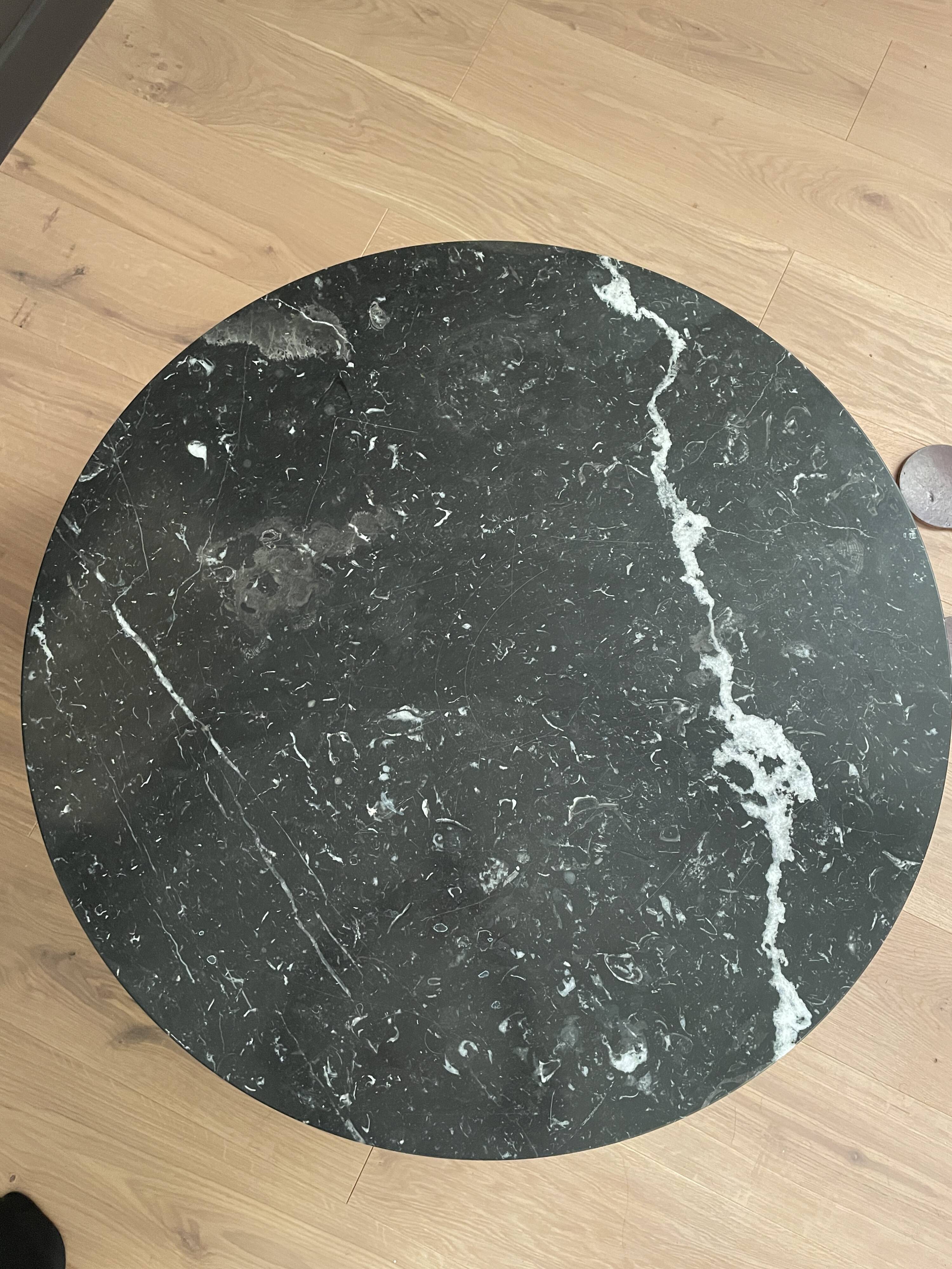 Black marble coffee table with wooden legs
