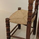 Pair of rustic chairs in turned wood with straw seats