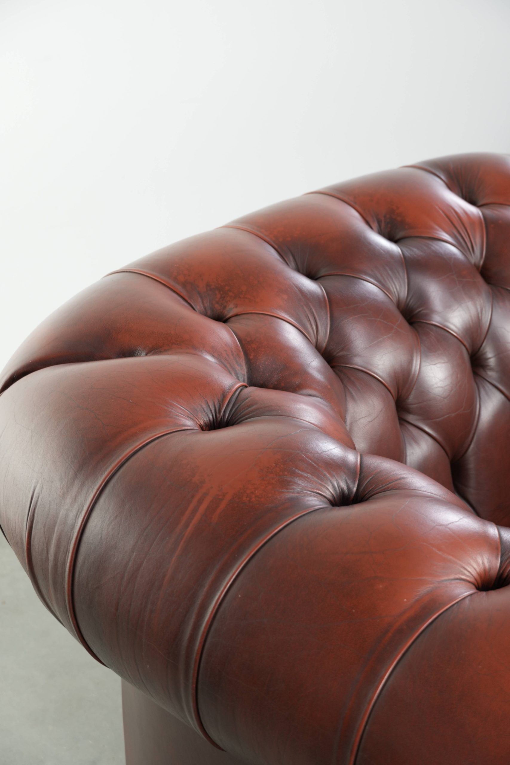 Cowhide Chesterfield armchair in a classic English style