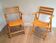 Pair of varnished wooden folding armchairs signed Clairitex.