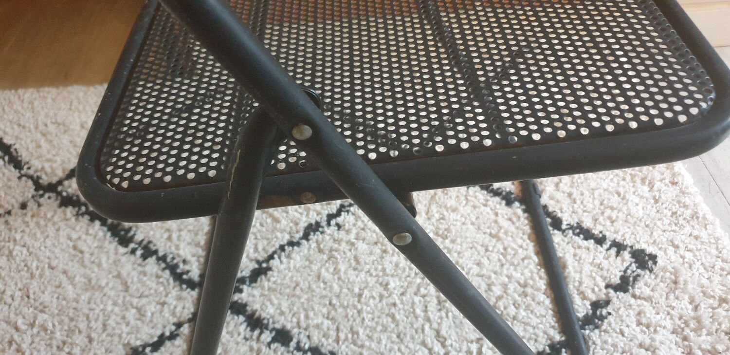 Pair of folding chairs in perforated metal