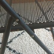 Pair of folding chairs in perforated metal