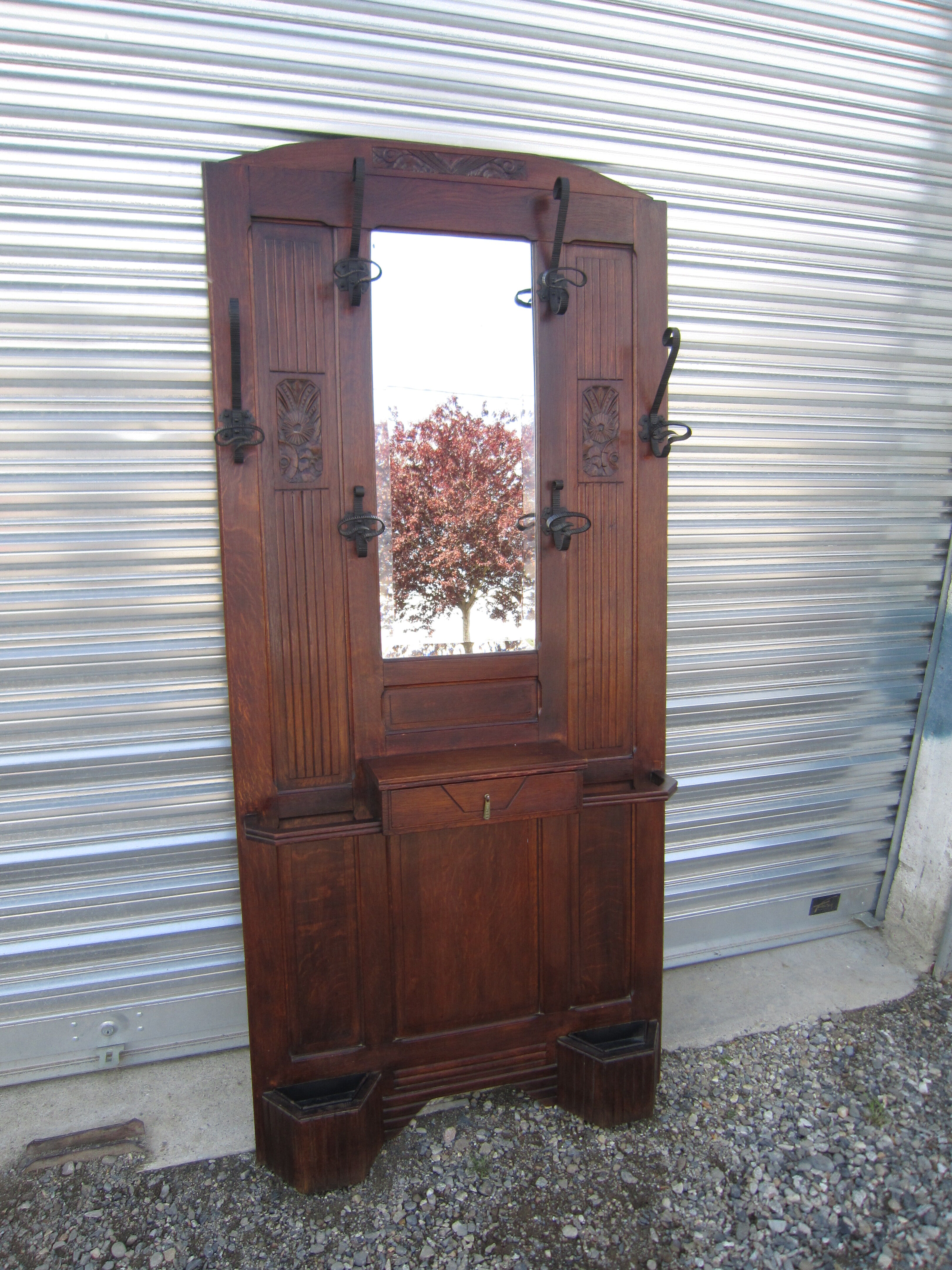 Vestiaire wears hat coat and art deco umbrella in wrought iron patere wood